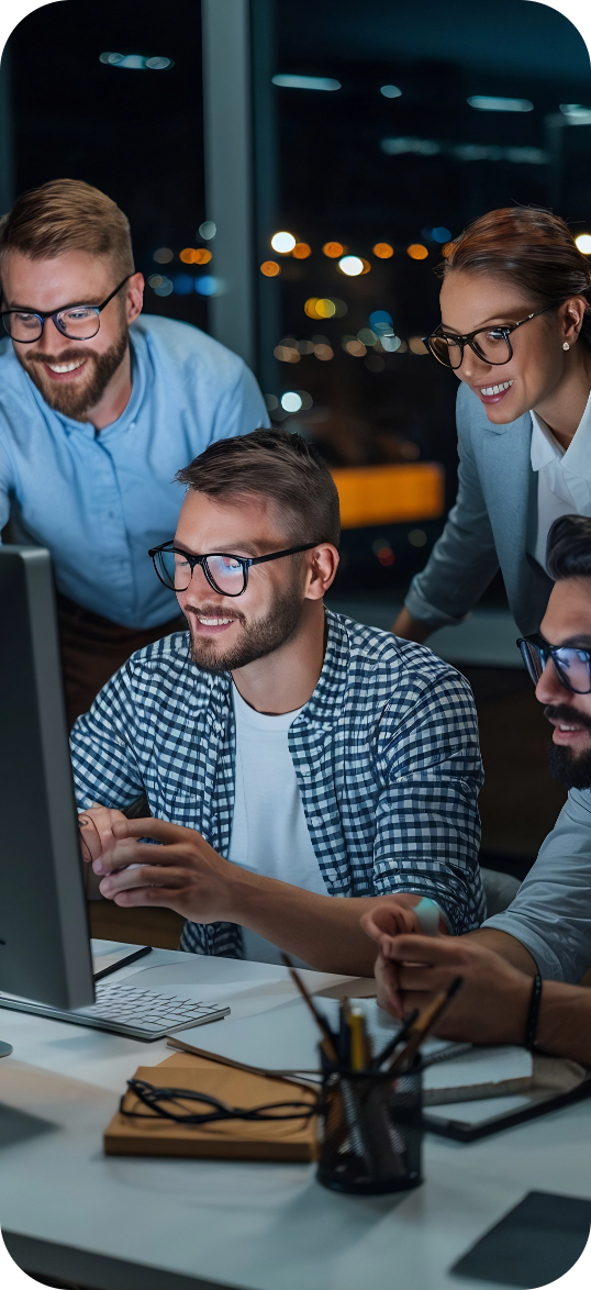 diverse-team-professionals-meeting-office-night-brainstorming-it-programmers-use-computer